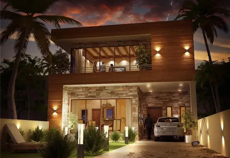 Contemporary house design with stone and wood cladding, lit at night